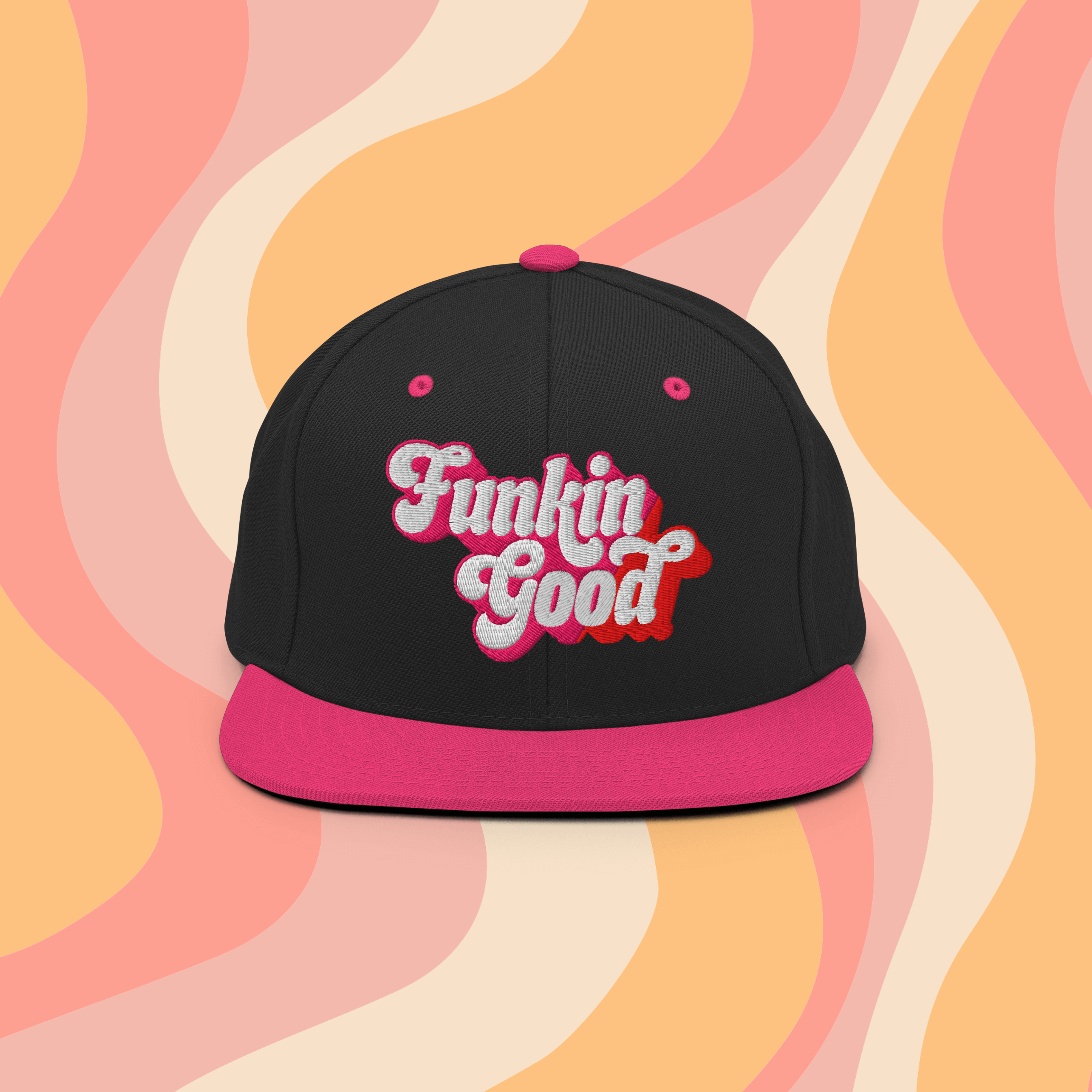 Funkin Good Snapback Hat in black and pink with bold logo on vibrant swirl background.